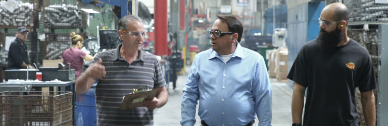 Mike Frumento on shopfloor with team member