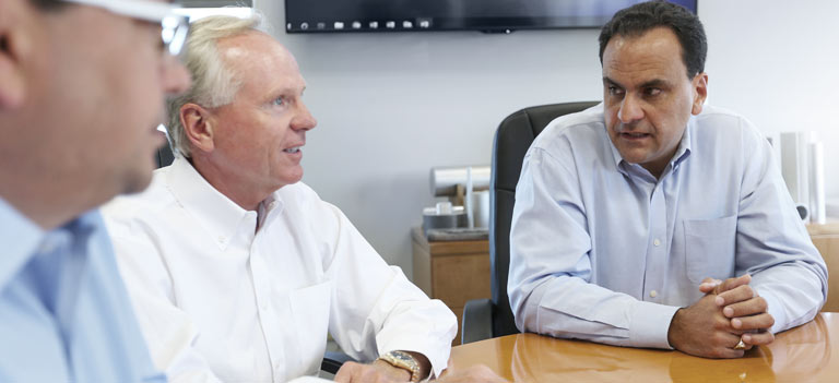 Leadership team in conference room collaborating